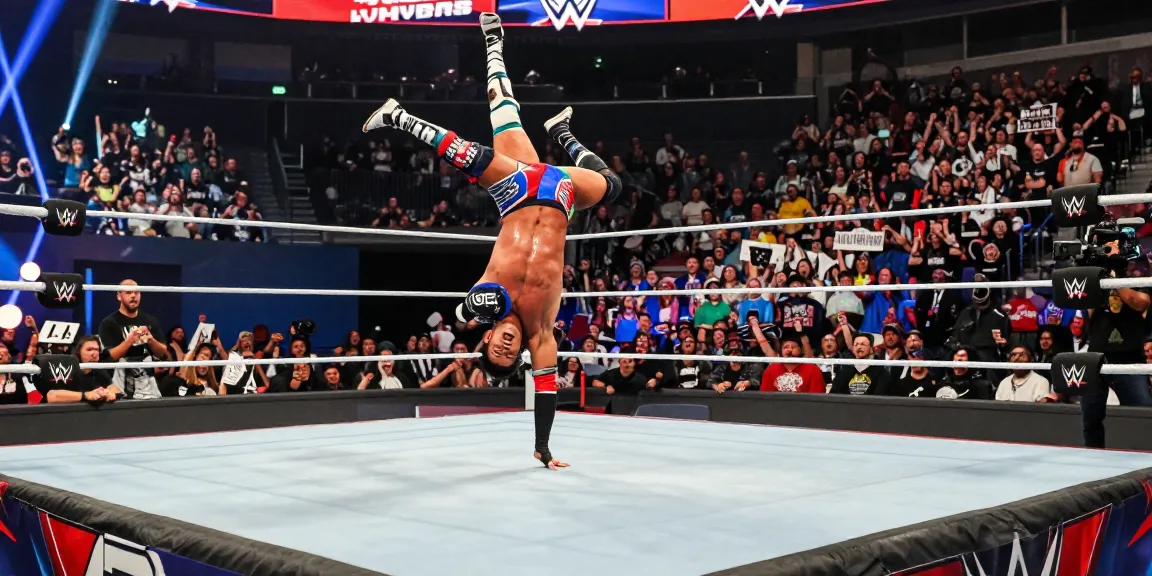 LA Knight performing in the wrestling ring with vibrant crowd cheering.